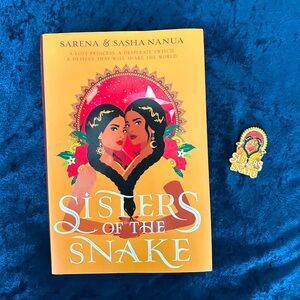 Book and Matching Pin! Sisters of the Snake - Book and Enamel Pin.